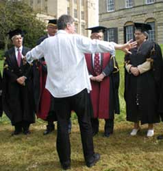 Members of the University leadership receive directions from Terry