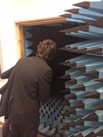 Colston students peer inside the anechoic chamber