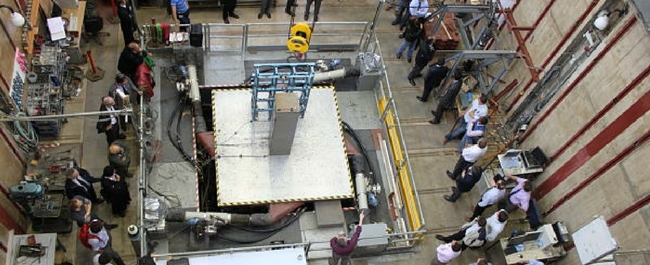 View from above of shaking table with people around it