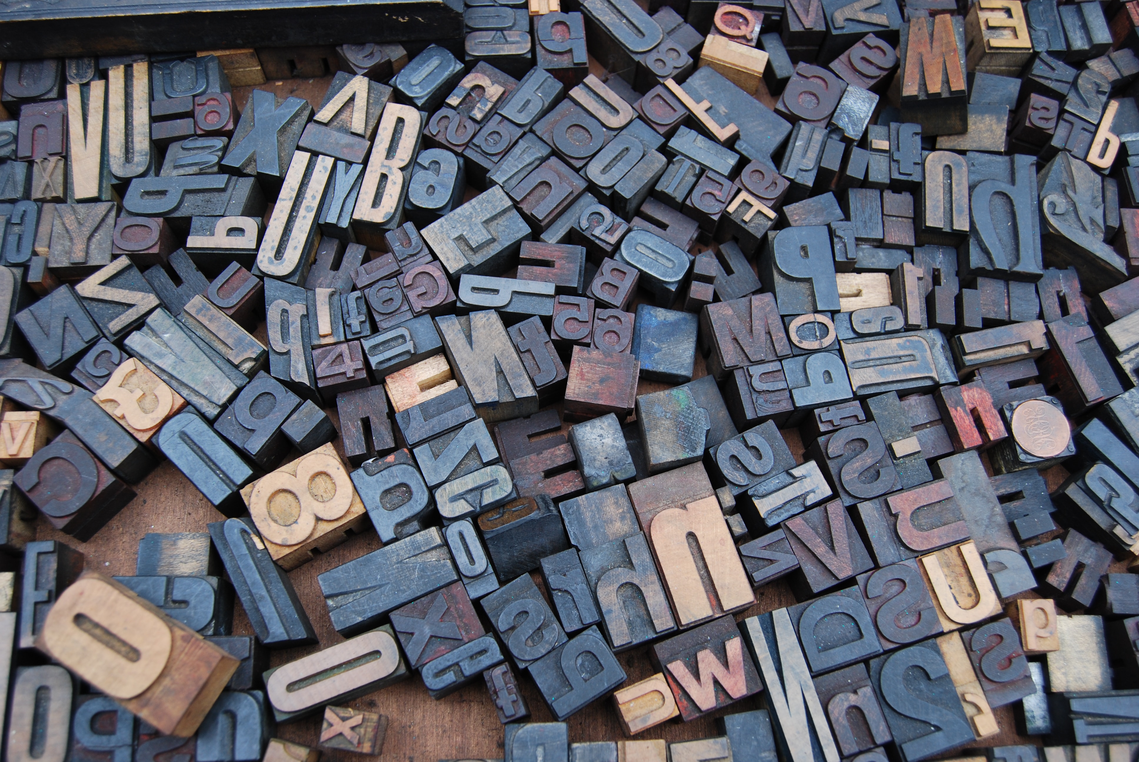 An assortment of letter stamps covered in ink