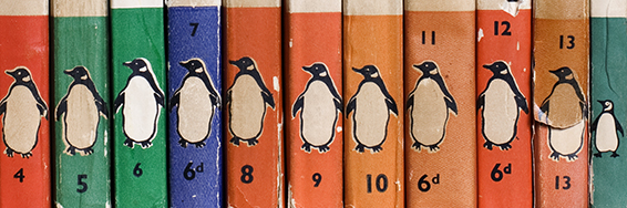 Close up of book spines all showing the Penguin Books logo.