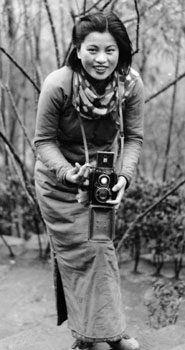 Min Chin posing with a camera at Northern Hot Springs in Sichuan province, 1940