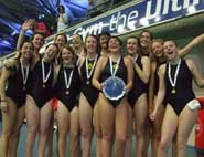 The women's waterpolo team display their trophy