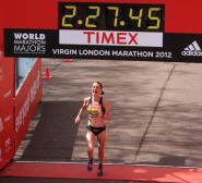 Claire Hallissey crosses the finish line at the Virgin London Marathon