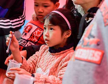 Child engaging in chemistry experiment