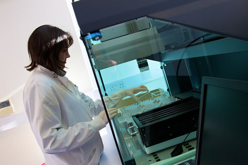 user using tecan robot for processing illumina arrays