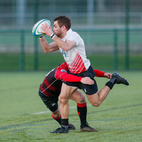 Rugby player being tackled during a game. Image links to Men's rugby union club page on Bristol SU website.	