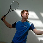 Squash player holding a squash racket. Image links to Squash club page on Bristol SU website.	