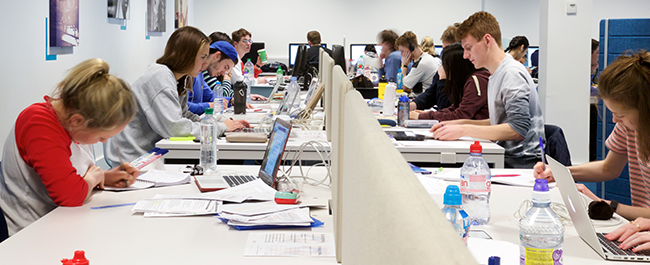 two rows of students studying on laptops. used to advertise study skills program