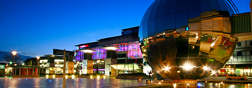 Millennium square in the city of Bristol at night.