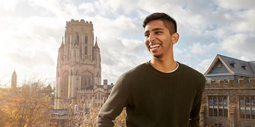 Student smiling in front of Wills Memorial Building.