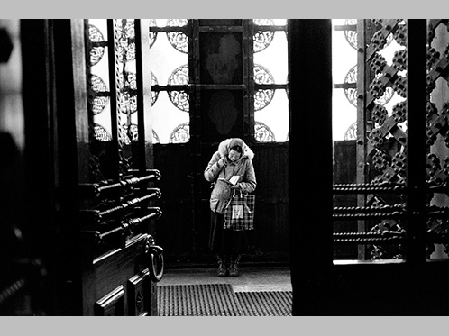 'Praying - an elderly lady says a prayer in the entrance to a church in Moscow' by Harry Engels