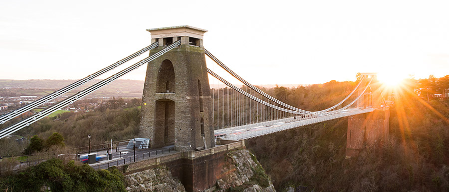 Bristol's Clifton Suspension Bridge with the sun setting in the background