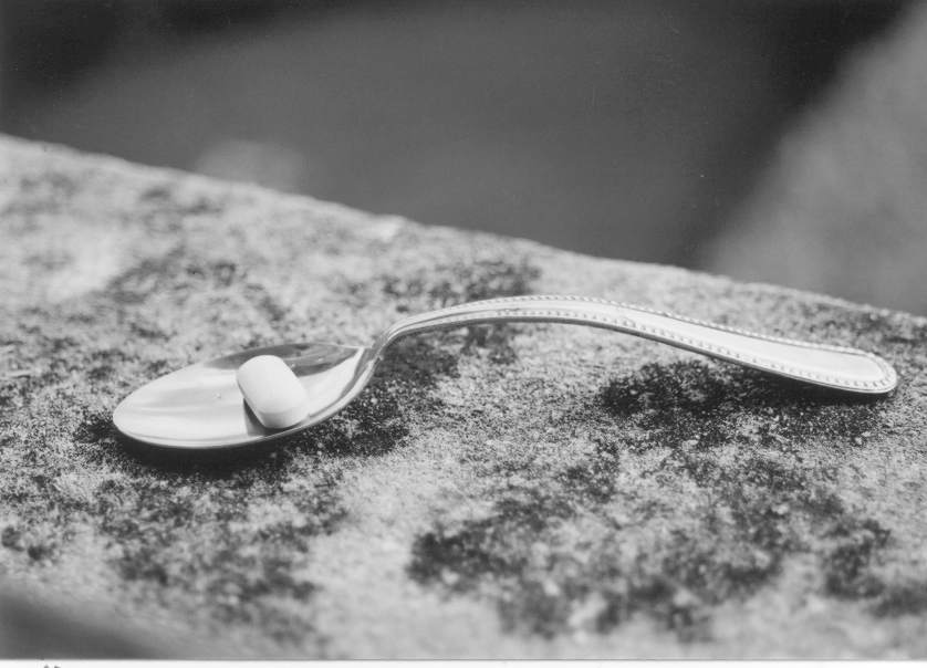 photograph of a pill on a spoon