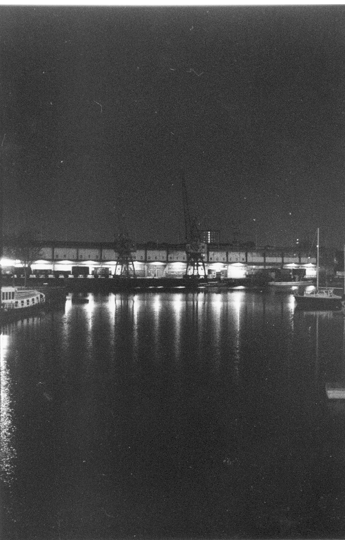 photograph of reflections on water at night