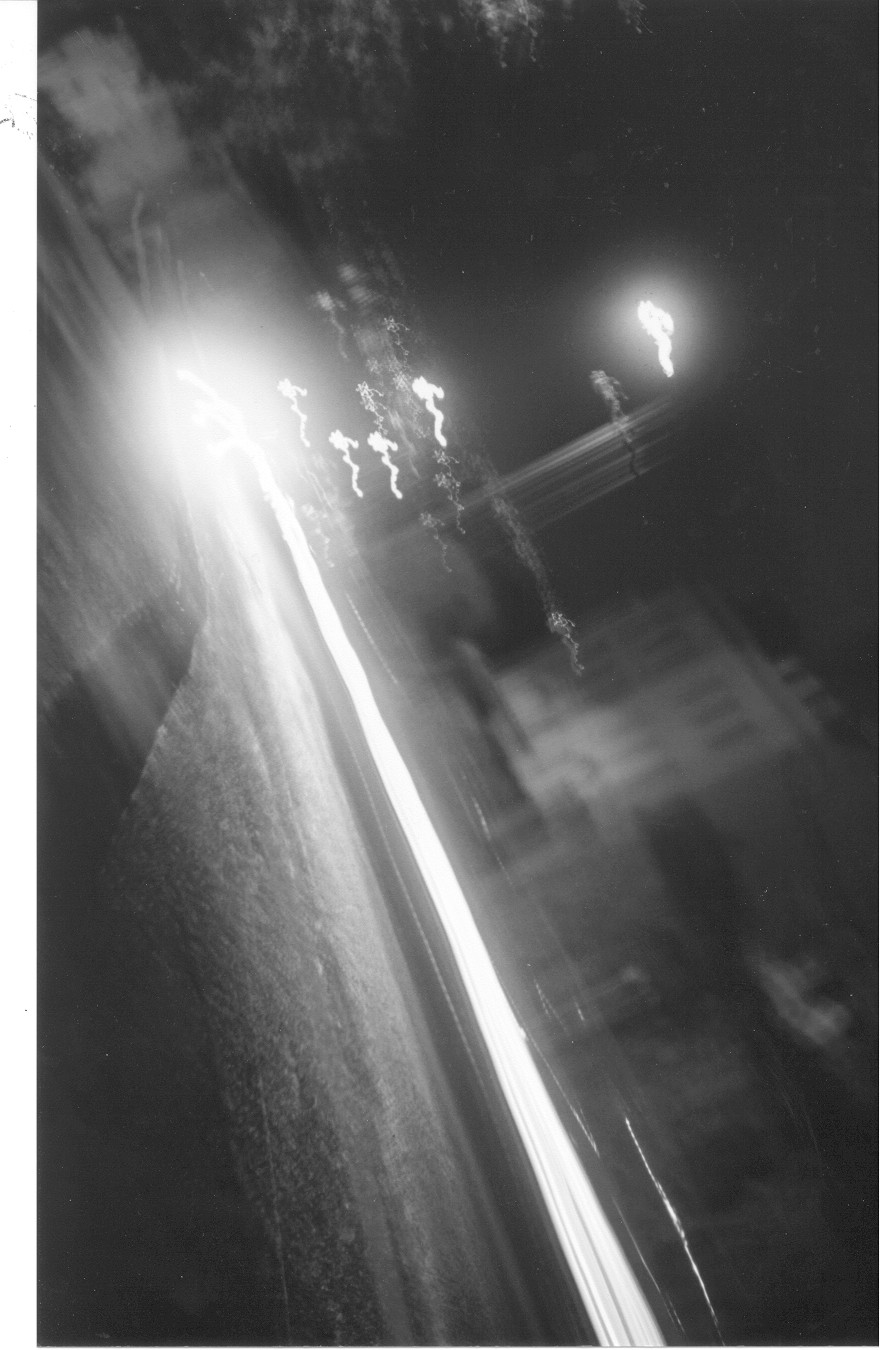 photograph of blurred street lights