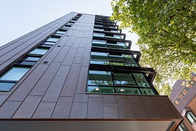 The exterior of a modern high rise building.