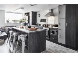 A modern shared kitchen and lounge area with an island breakfast bar, integrated appliances, seating and contemporary furnishings.