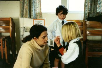 Lisa helping a girl to work out how to use the sensor