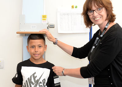 10-year-old COCO90s Coby having his height measured
