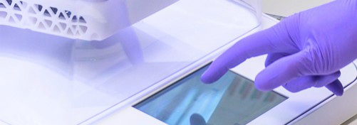 biodesign research gloved hand operating equipment