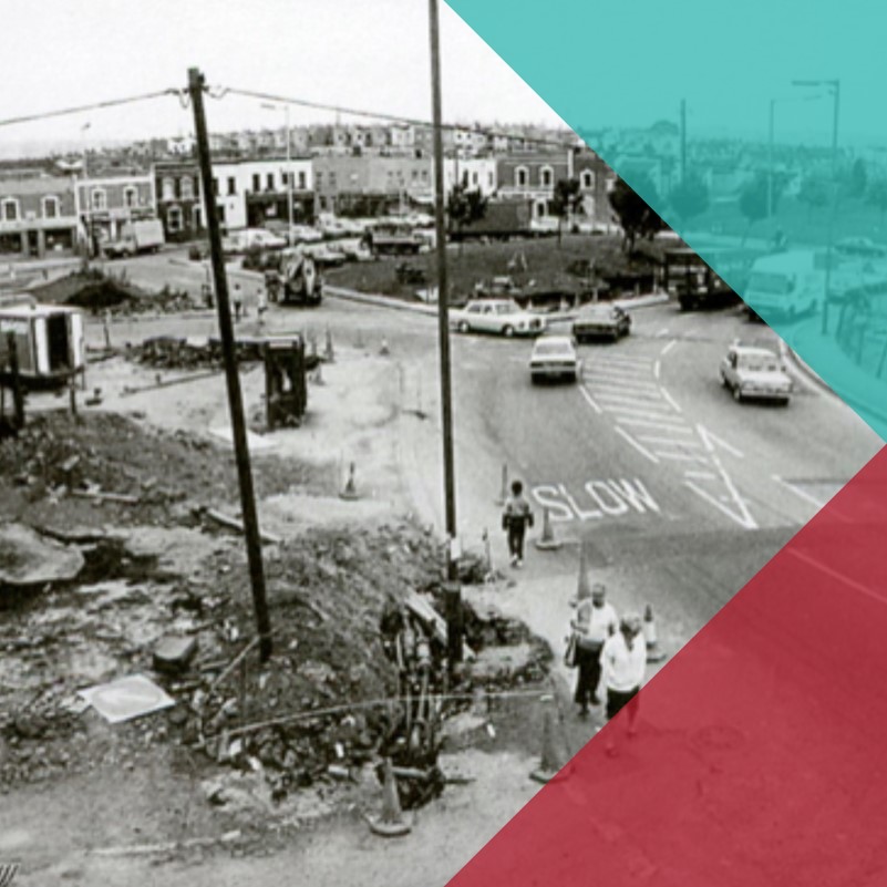 A black and white photograph of a road in Bristol with redevelopment work in progress.