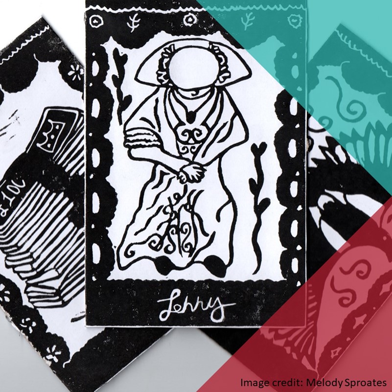 A photograph of three printed black tarot cards, one with a stack of money, one with a robed figure, and one with a bird