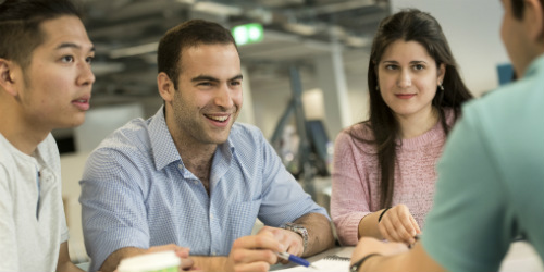 Students in group talking.