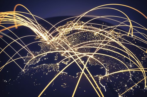 Conceptual view of the Earth from space showing a telecomms network as many golden lines
