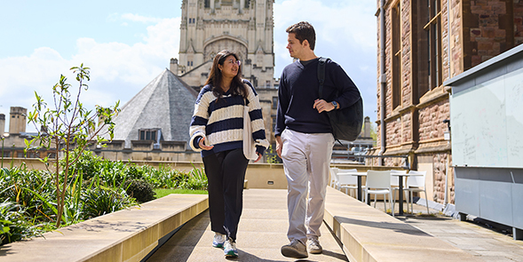 two students walking through campus
