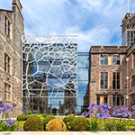Image of the rear of the Fry Building with grass in the foreground