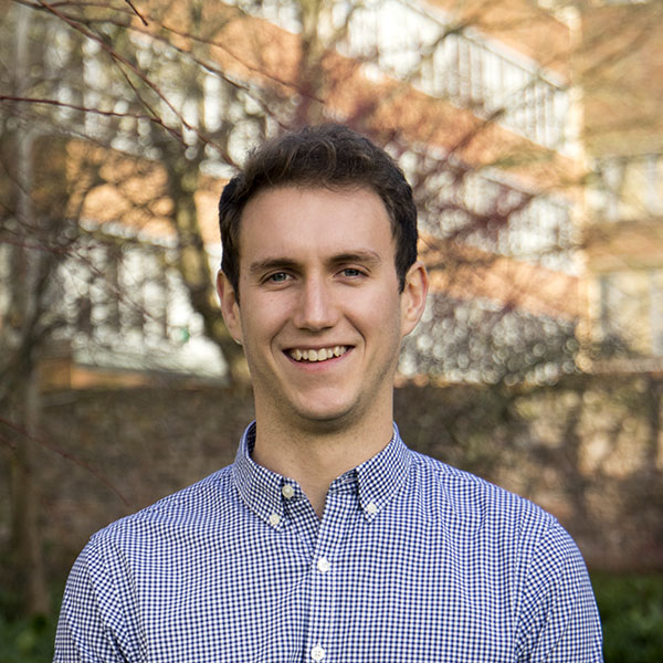 A person in a blue and white checked shirt.