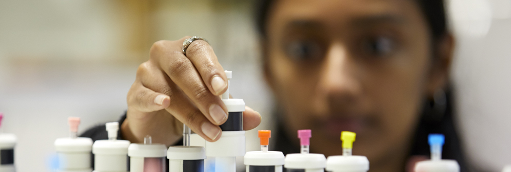 A student examining some chemical samples