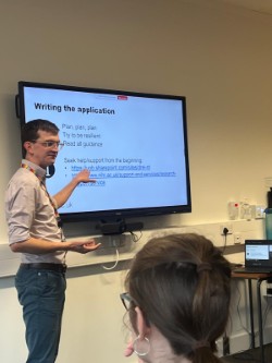 A person showing a powerpoint slide