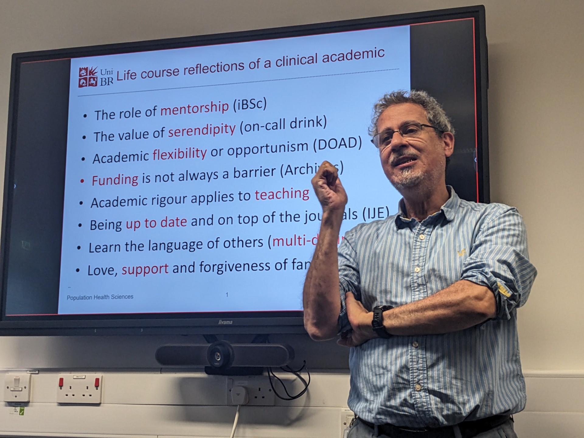 Picture of Yoav infront of a powerpoint pt2