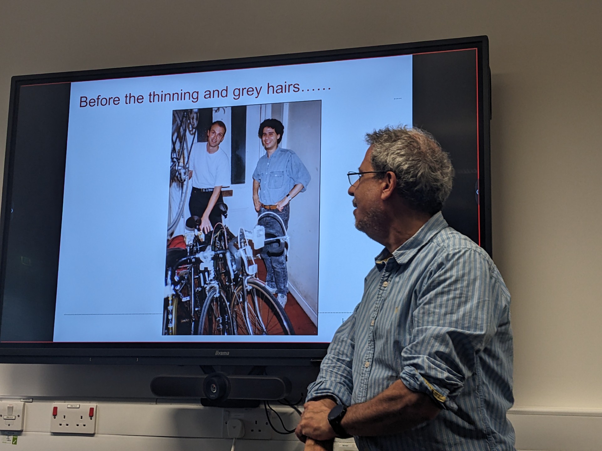 Picture of Yoav infront of a powerpoint