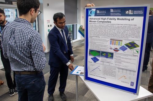Nuhaadh Mahid in front of his poster at the BCI PGR Symposium 2024