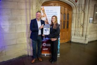 Craig Carr handing Jula Schroeder her certificate for the Best Taught Mark prize