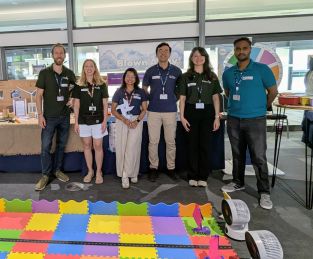 Six BCI staff and students stood in front of the BCI FUTURES stall