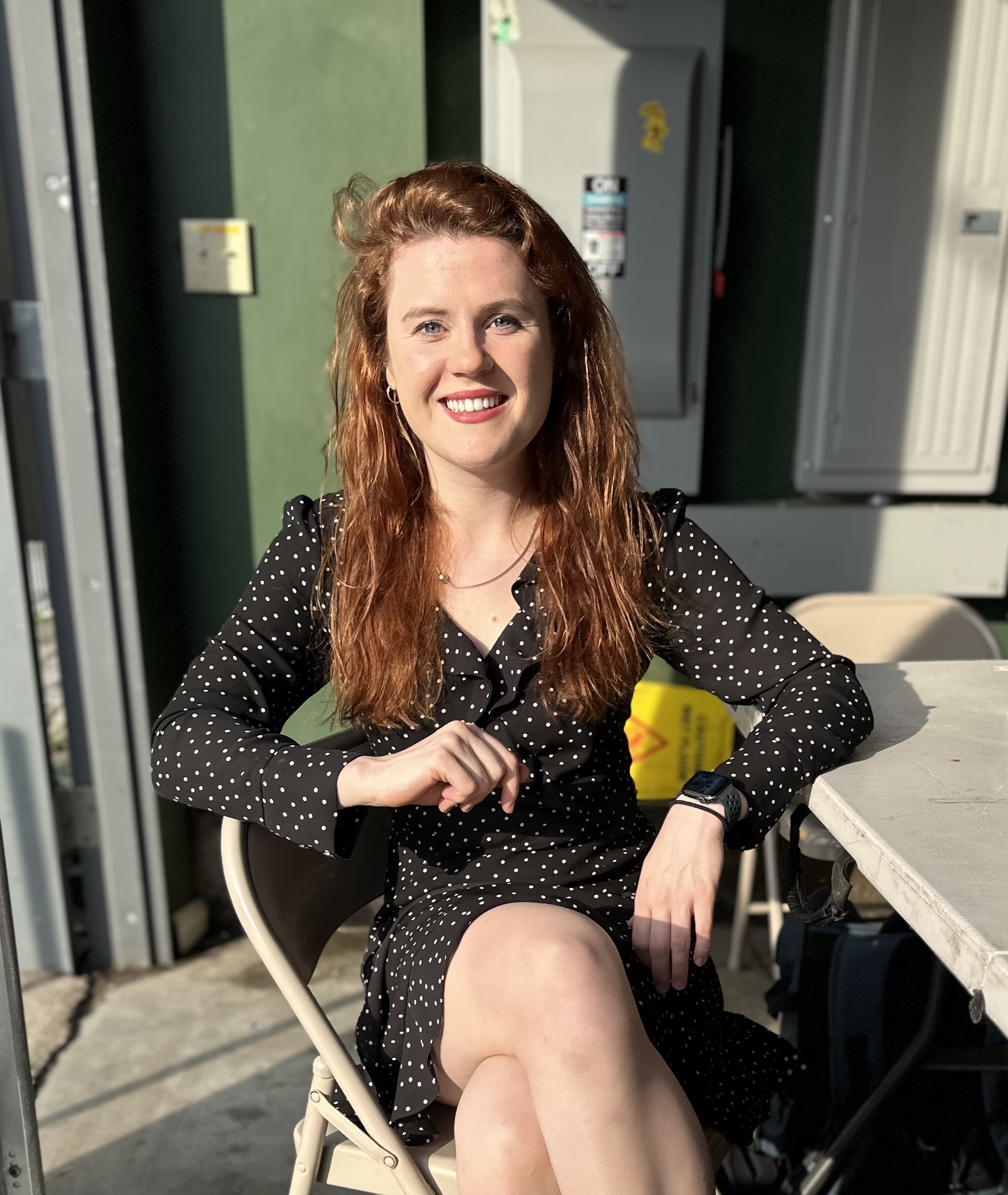 Emily Black sitting on chair