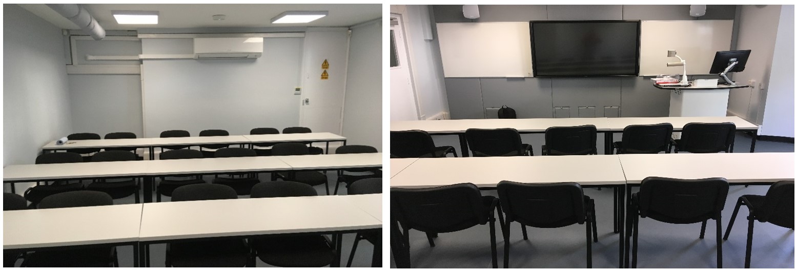 Rows of chairs and tables facing the teaching wall.