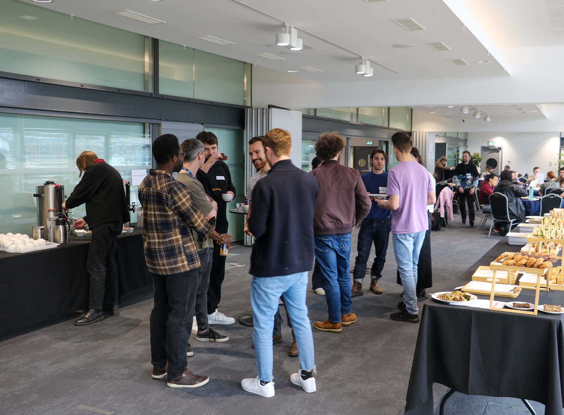 Students socialising at World Café Knowledge Exchange event