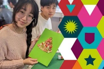 Student holding a Christmas card