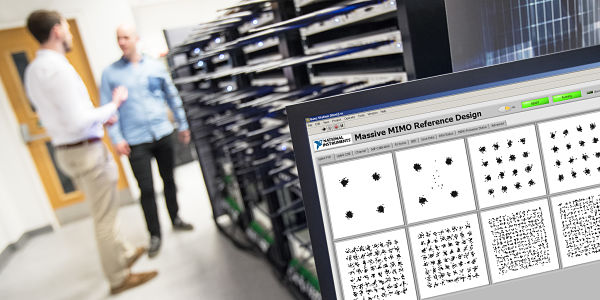 Two male researchers next to the MIMO testbed