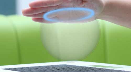 Haptic display creating ring of blue light on human hand