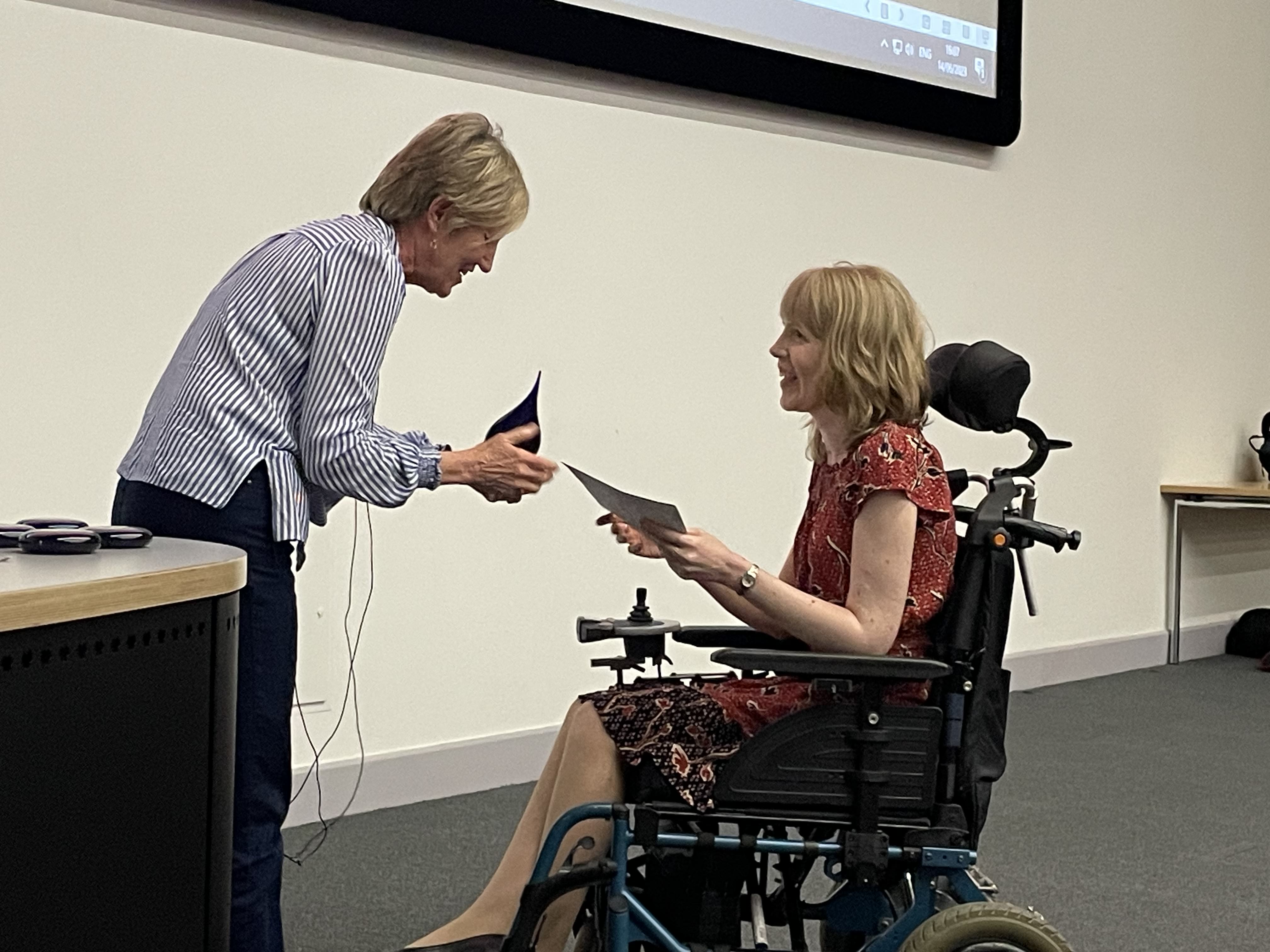 Rachel Hare receiving winning prize for the Three Minute Thesis competition