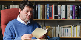 Danny Karlin reading from a book