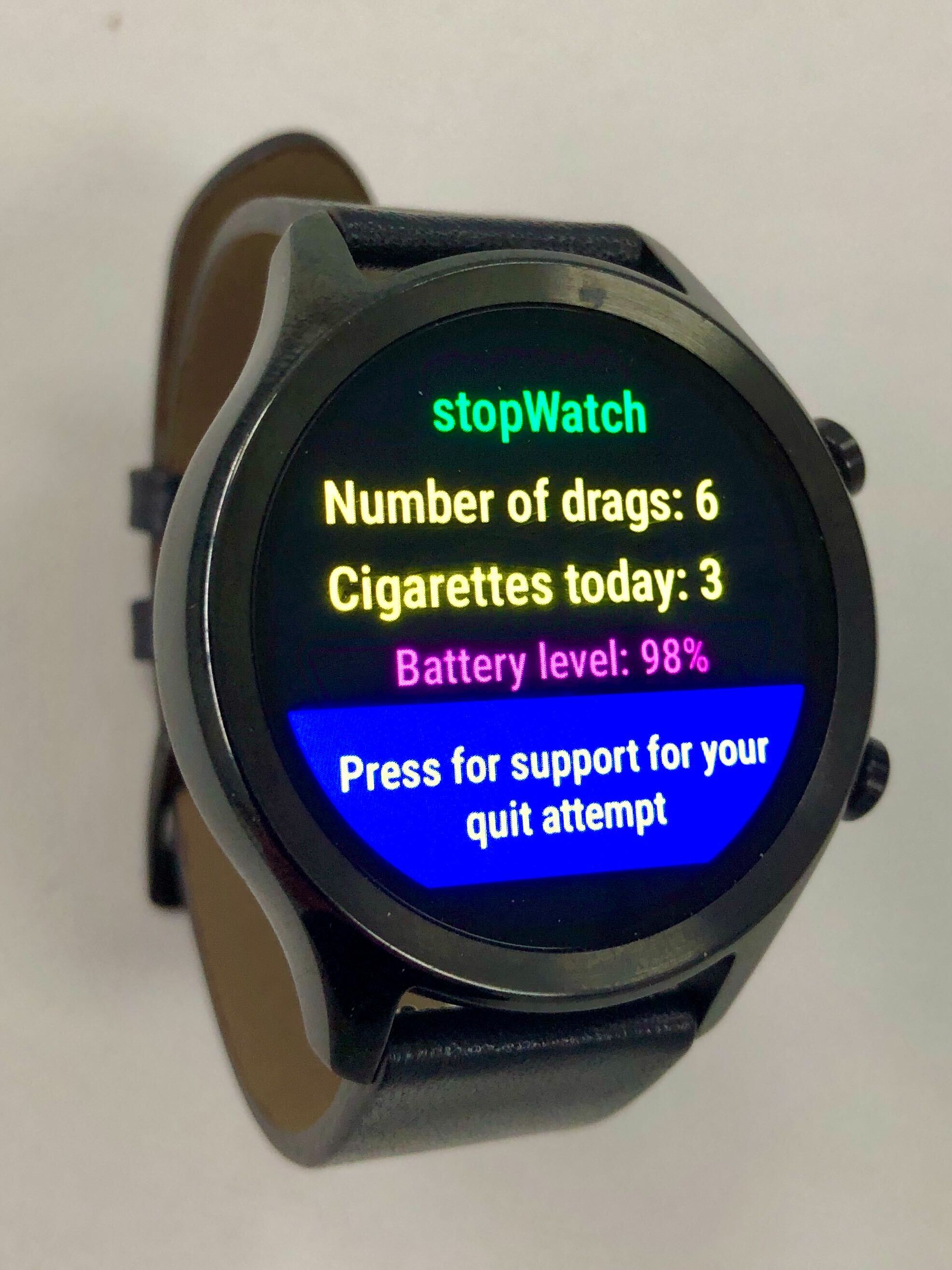 A photo of a smartwatch, displaying a count of the amount of times smoked this day