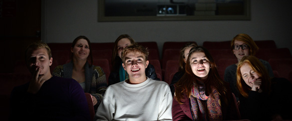 Students watching a film screening.