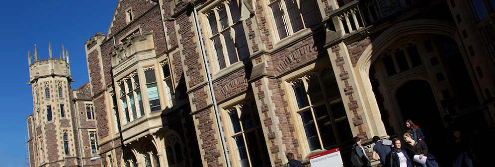 A group of people stood outside the Geographical Sciences building.